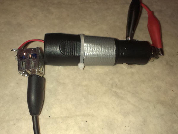 duct-taped and ziptied smartphone charger